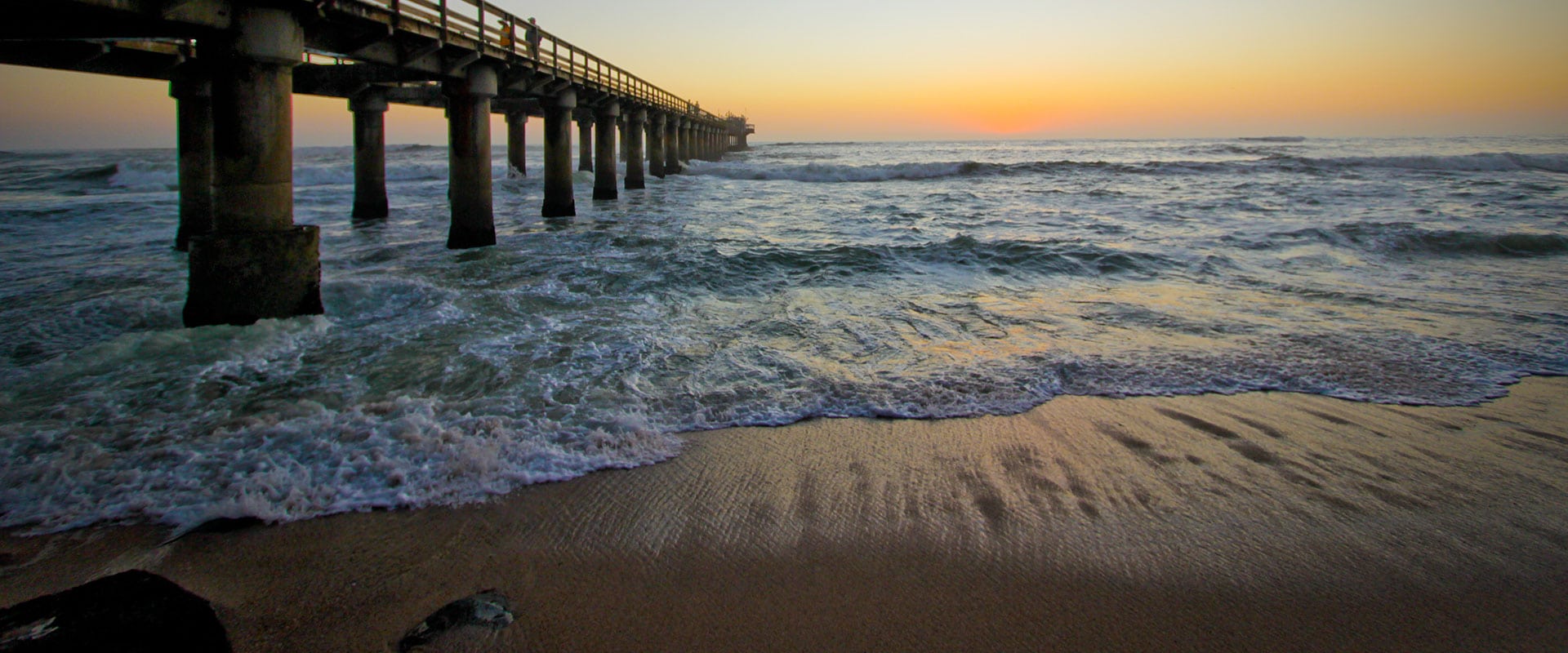 Sip sundowners on the historical jetty