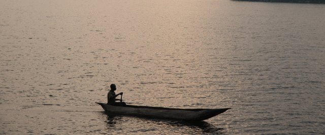 A canoe at sunset on a lake in the Democratic Republic of Congo